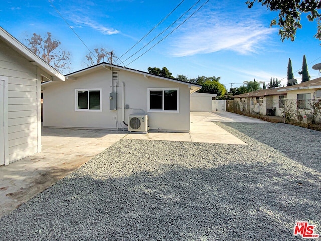 back of house featuring ac unit and a patio