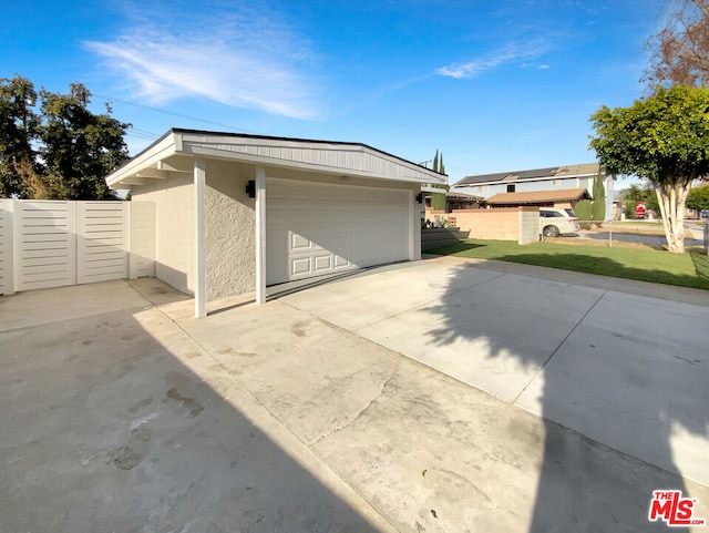 garage with a yard