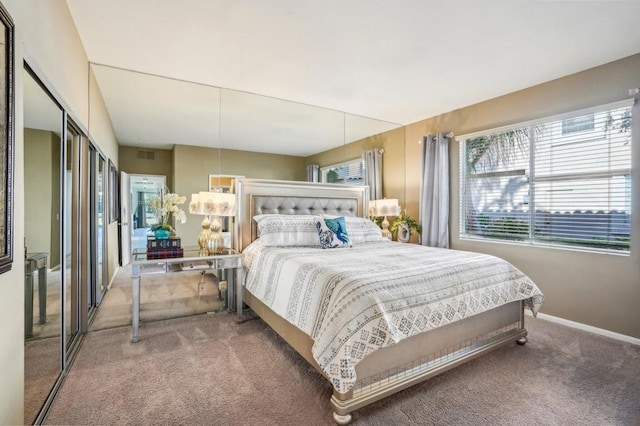 carpeted bedroom featuring a closet