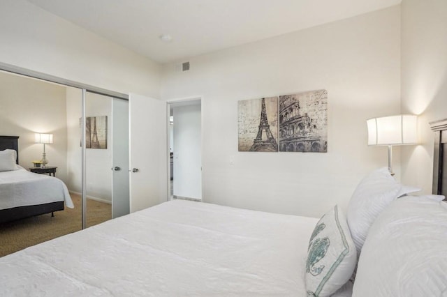 bedroom featuring carpet and a closet