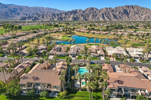 bird's eye view with a water and mountain view