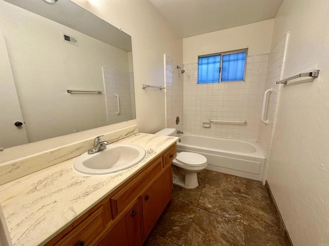 full bathroom with toilet, vanity, and tiled shower / bath combo