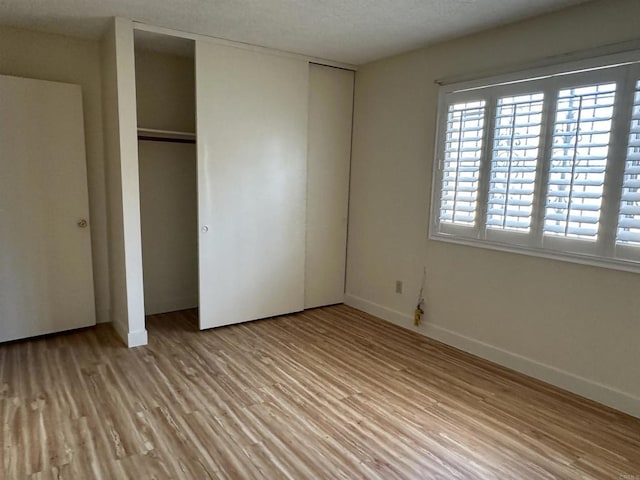 unfurnished bedroom featuring light hardwood / wood-style floors