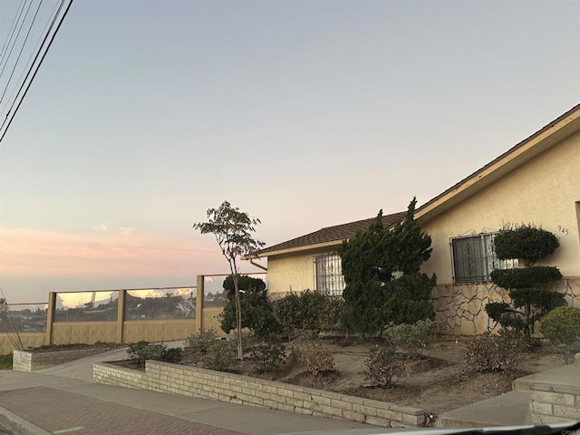 view of property exterior at dusk