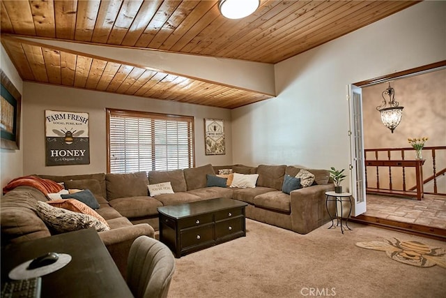 living room with carpet, wooden ceiling, and vaulted ceiling