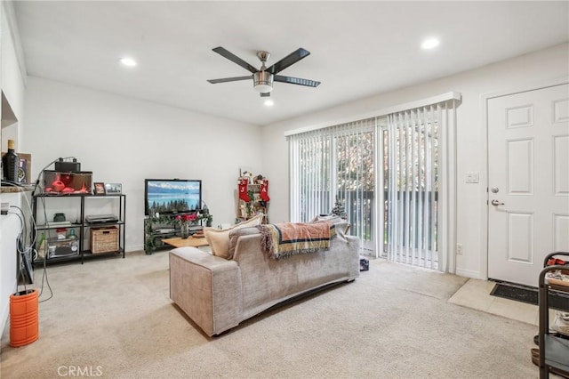 living room with ceiling fan and light colored carpet