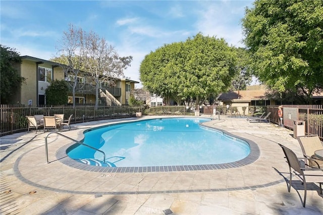 view of swimming pool with a patio