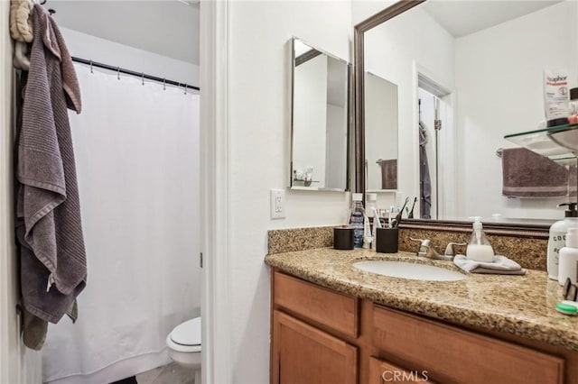 bathroom with vanity and toilet