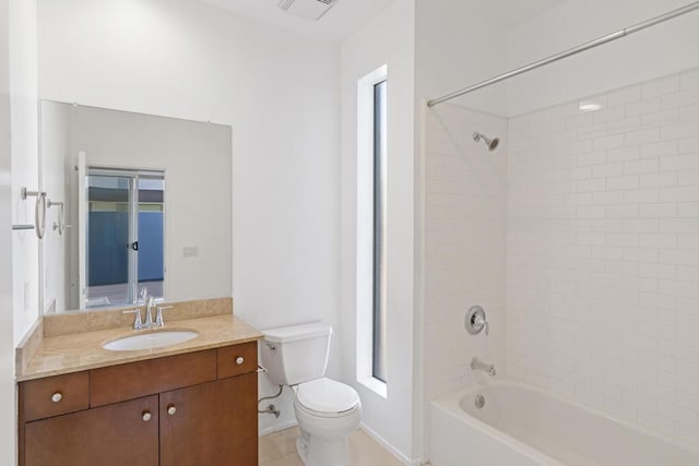 full bathroom with toilet, vanity, and tiled shower / bath combo