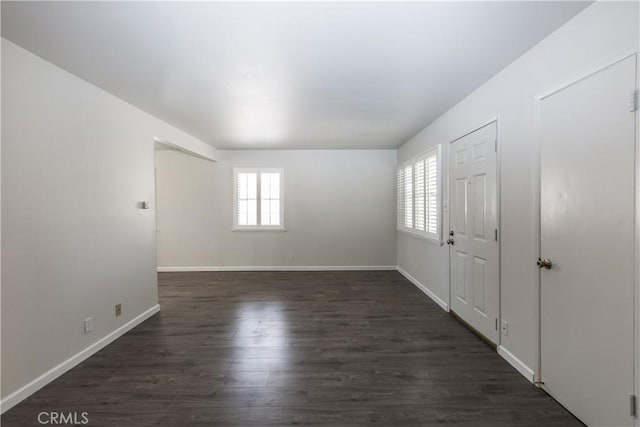 empty room featuring dark hardwood / wood-style floors