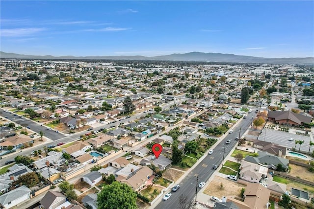 birds eye view of property with a mountain view