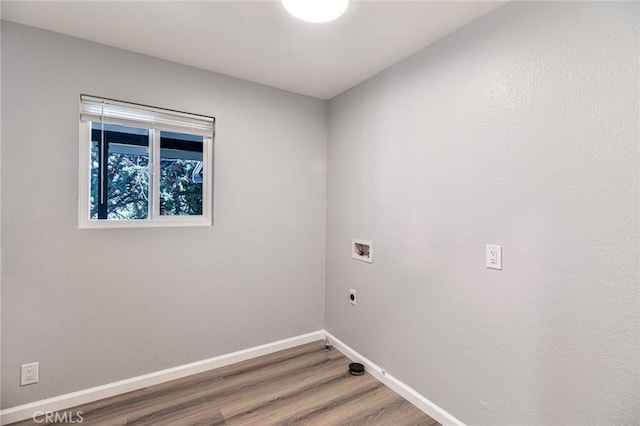 washroom featuring electric dryer hookup, hardwood / wood-style floors, and washer hookup