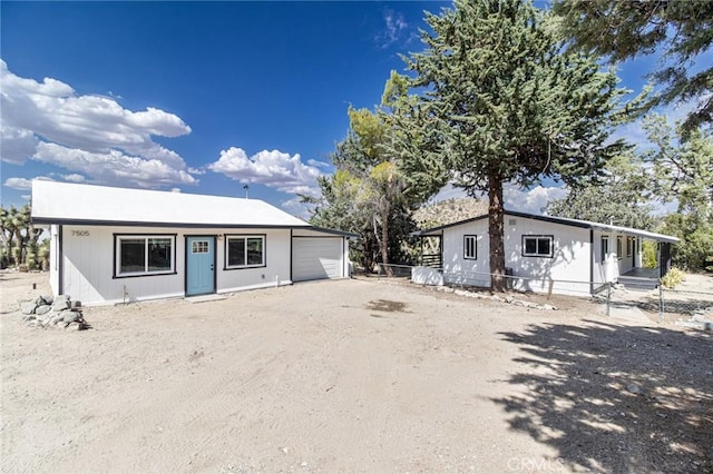 view of front of home with an outbuilding and a garage