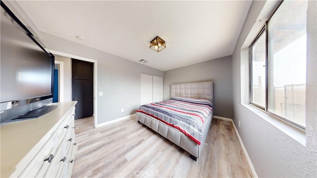 bedroom featuring light hardwood / wood-style flooring