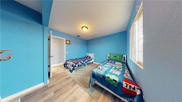 bedroom featuring light hardwood / wood-style floors