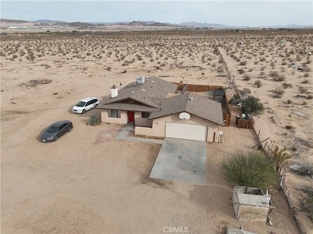 drone / aerial view featuring a mountain view