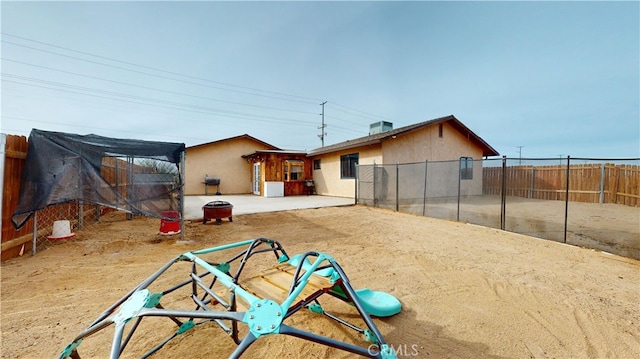 back of house with a patio and central air condition unit