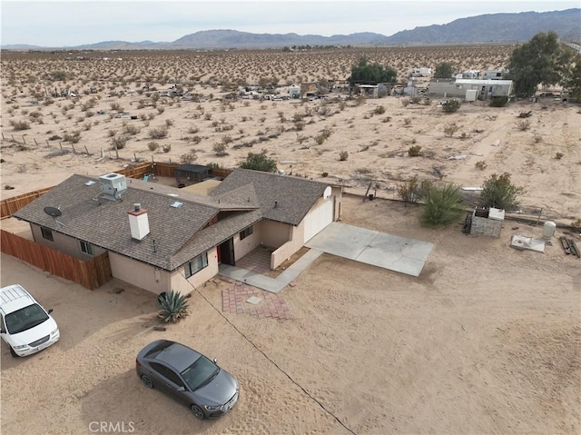 birds eye view of property featuring a mountain view