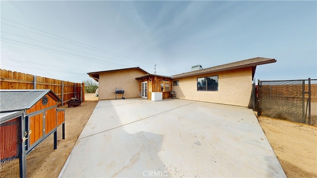 back of property with a patio area