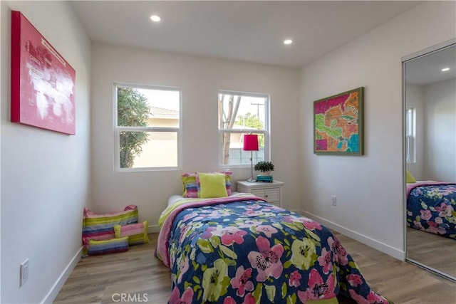 bedroom with light wood-type flooring