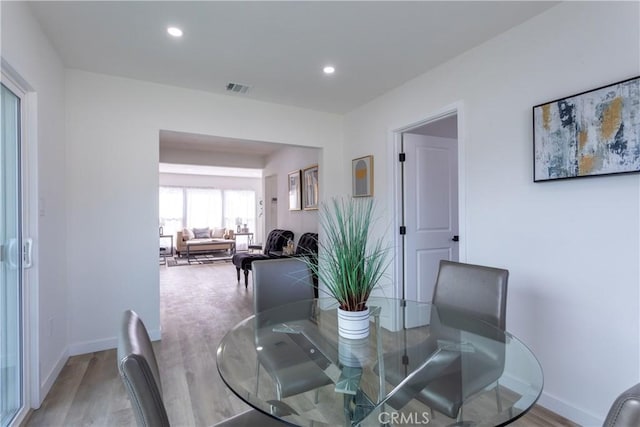 dining area featuring hardwood / wood-style floors