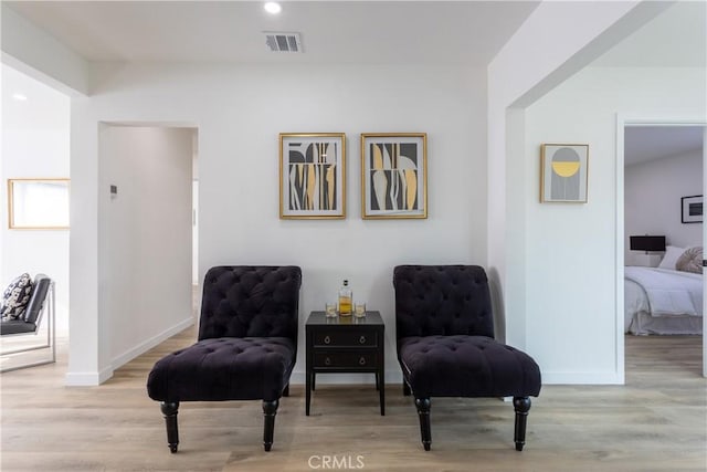 sitting room featuring light hardwood / wood-style floors