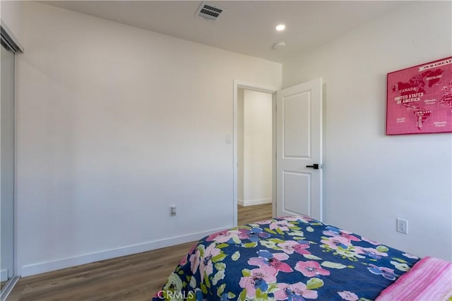 bedroom featuring wood-type flooring