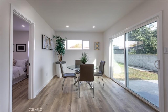 dining space featuring light wood-type flooring