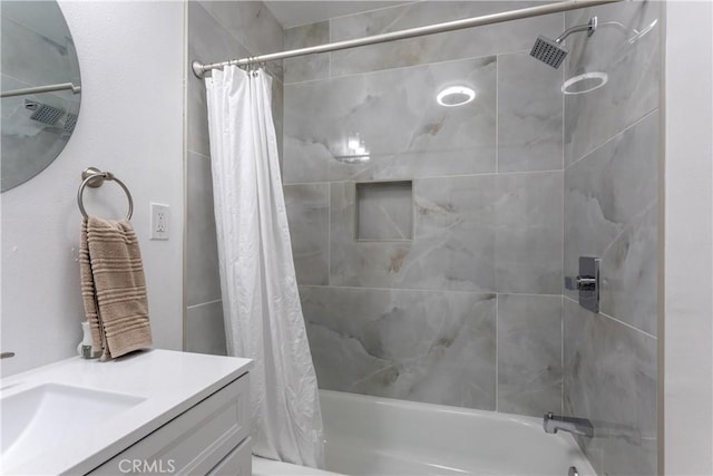 bathroom featuring vanity and shower / tub combo