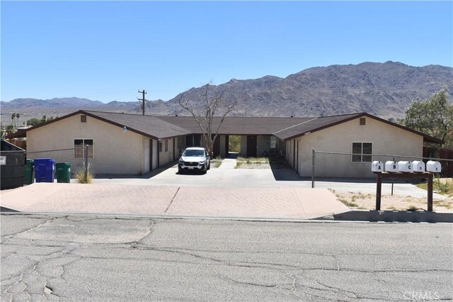 ranch-style home with a mountain view