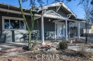 view of front of home featuring covered porch