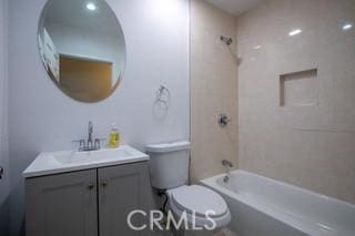 full bathroom with vanity, toilet, and tiled shower / bath