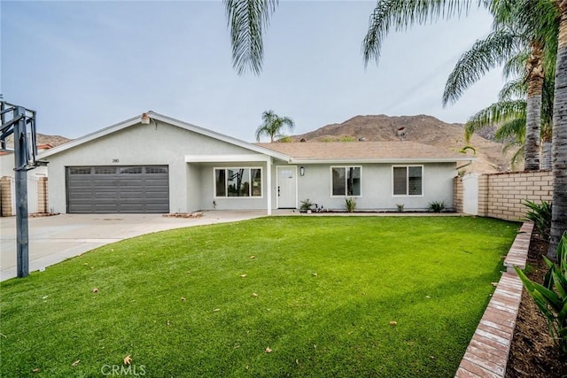 view of front of house featuring a front lawn and a garage