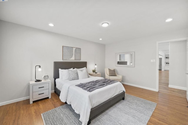 bedroom with hardwood / wood-style floors