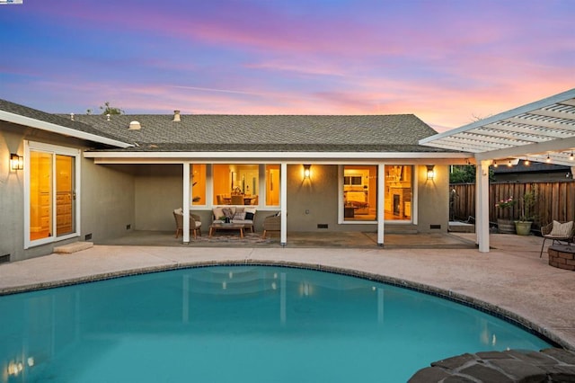 pool at dusk with a pergola and a patio area