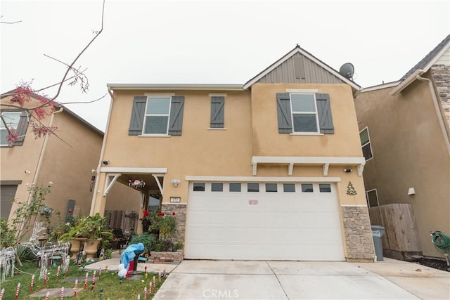 view of front of property featuring stucco siding, stone siding, a garage, and driveway