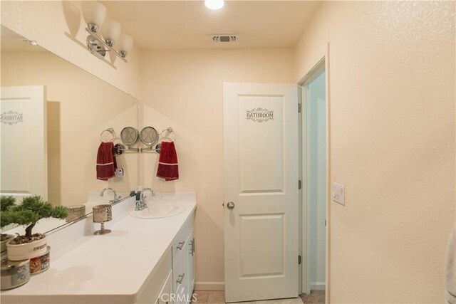 bathroom featuring tile patterned floors and vanity