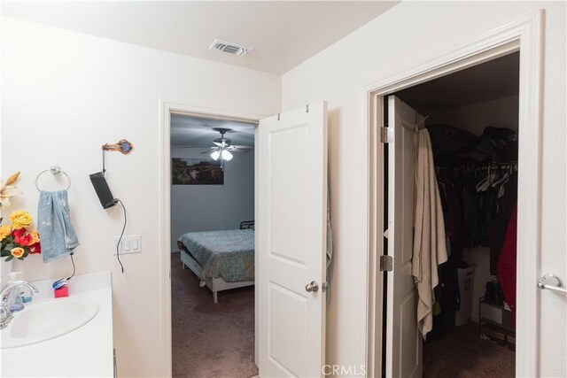 bathroom featuring ceiling fan and vanity