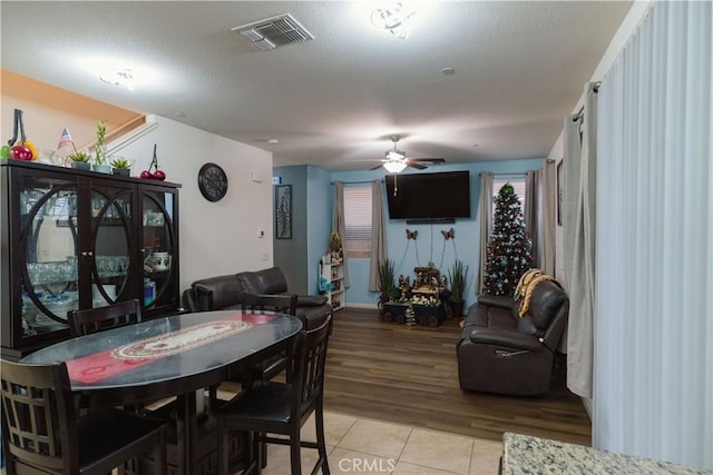 dining room with ceiling fan and light tile patterned floors