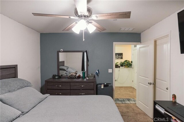 bedroom featuring ceiling fan and carpet floors