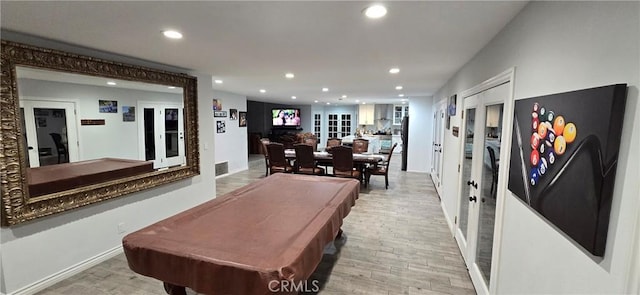 rec room featuring french doors, pool table, and light hardwood / wood-style floors