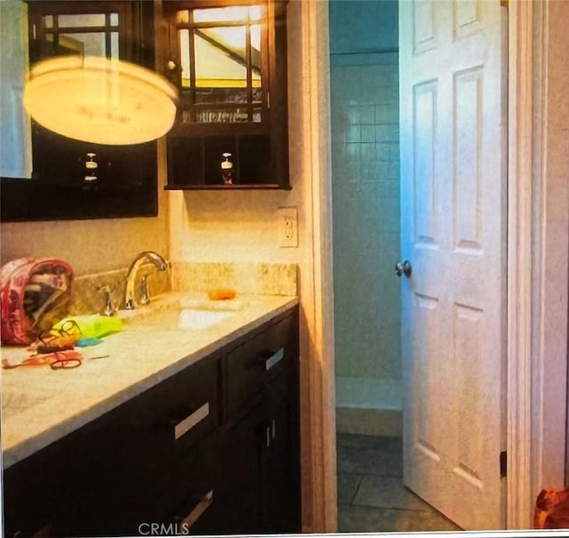 bathroom featuring tile patterned floors and vanity