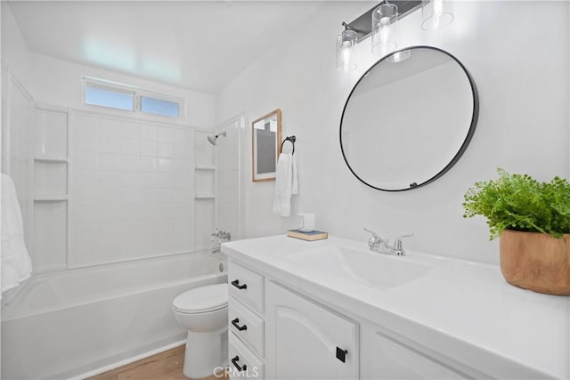 full bathroom featuring bathtub / shower combination, hardwood / wood-style floors, vanity, and toilet