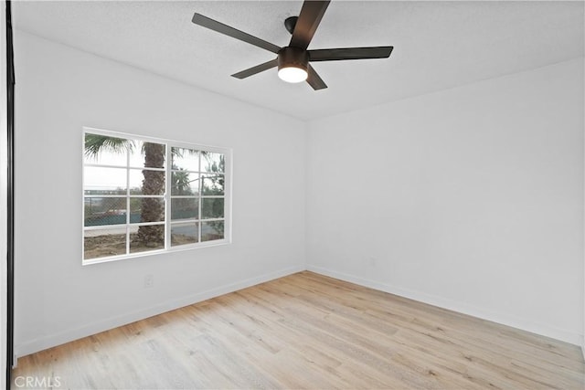 spare room featuring ceiling fan and light wood-type flooring