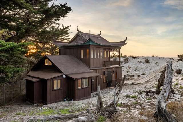 back house at dusk featuring a mountain view