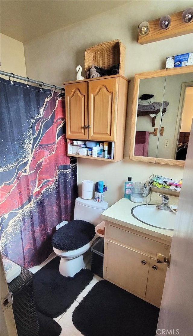 bathroom featuring toilet and vanity