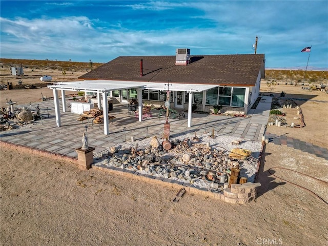 rear view of property featuring a patio area