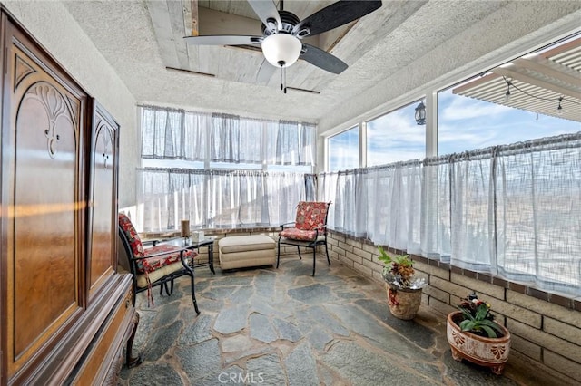 sunroom / solarium with ceiling fan