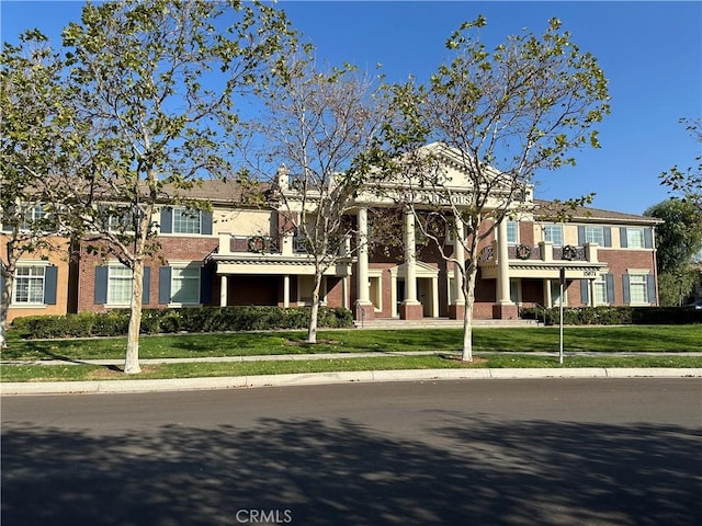 view of property with a front lawn