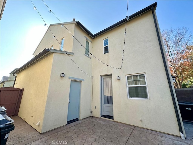 rear view of property featuring a patio